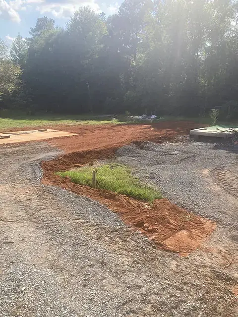 Gravel spreading and dirt work for a client's drive