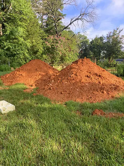 Moving piles of dirt for a customer